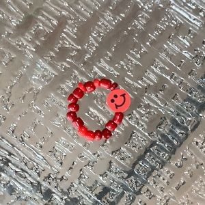 Red smiley face ring